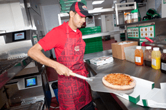 Man packing pizza