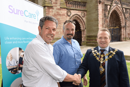 Men shaking hands with mayor